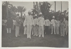 Group watching the hoisting of the flag after the reading of the proclamation of the annexation of Niue - Photograph taken by Malcolm Ross