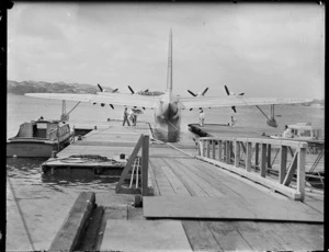 TEAL Solent flying boat Awatere being prepared for the first departure from the new pontoon, Evans Bay, Wellington