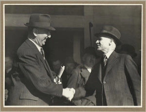 Boyer, Charles Percy Samuel, d 1973 :Photograph of John Hicks McIlroy and Sidney George Holland shaking hands