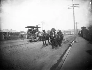 Road construction using a steam engine and horse-drawn equipment