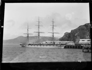 Sailing ship Brahmin, at the wharf beside the Shaw, Savill & Albion Co., buildings at Port Chalmers