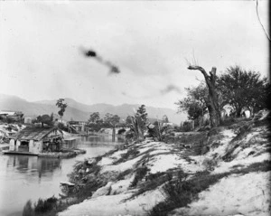 Scene alongside the Ohinemuri River, near Paeroa, with a goldmining dredge