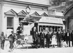 Tram, Wellington, and group of men and children alongside