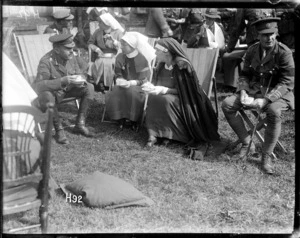 General Russell takes tea at a garden party in the grounds of the New Zealand Stationary Hospital