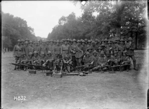 A New Zealand Rifle Brigade raiding party pose with captured machine guns, France