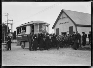 Children boarding an Edison electric bus outside the Orange Hall, Hornby, Christchurch