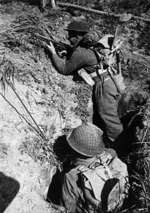 Two New Zealand soldiers, in a slit trench during World War II, Senio area, Italy