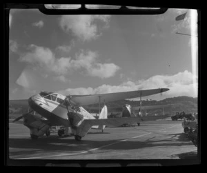 New Zealand National Airways Corporation de Havilland Dominie 'Tawaka', and another [de Havilland Dominie?] aeroplane behind, on tarmac at Rongotai Airport, Wellington