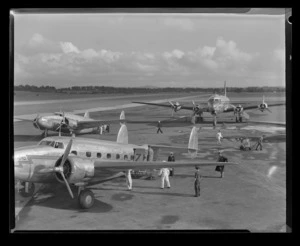 Two Lodestars, New Zealand National Airways Corporation, with a Clipper Monsoon at rear, Pan American World Airways,[Whenuapai Aerodrome, Auckland]