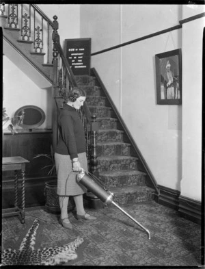 Woman using a vacuum cleaner