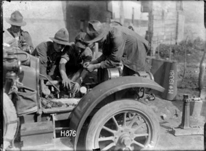 Soldiers repairing a car at the New Zealand Motor Transport Company workshops, Bonnieres, World War I