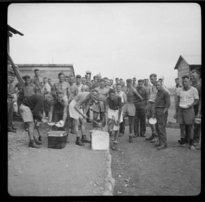 Prisoners of war at Camp 57, Gruppignano, Italy, lining up for food - Photograph taken by Lee Hill