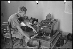 World War II soldier from New Zealand, L N Richards, operating sound ranging equipment in a forward area during the battle for Florence, Italy - Photograph taken by George Kaye