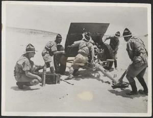 Artillerymen of the New Zealand Expeditionary Force at Maadi, Egypt, swinging a field gun into position, during World War 2