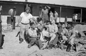 New Zealand soldiers waiting to serve Christmas dinner at the Maori Training Depot, Maadi, Egypt, during World War II - Photograph taken by George Bull