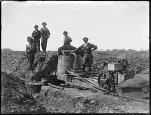Men washing soil to find kauri gum, Northland