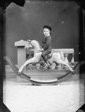 Young boy on a rocking horse