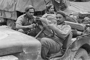 Members of the Maori Battalion during World War II, at Hove Dump, near Cassino, Italy, about to take supplies to the forward areas - Photograph taken by George Bull