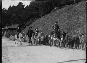 Children riding donkeys at Wellington Zoo
