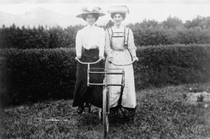 Unidentified women on a bicycle made for two