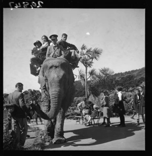 Children from Tokomaru Bay, East Coast, riding on an elephant at Wellington Zoo