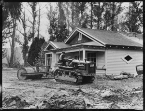 Earthworks; shows a caterpillar tractor with killefer scraper