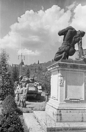 World War II soldiers from New Zealand at Castiglione, Italy, by a war memorial for Italian soldiers who fell during World War I - Photograph taken by George Kaye