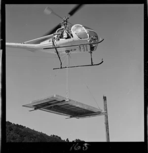 Helicopter transporting construction materials to Dunlop factory, Upper Hutt