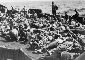 New Zealand soldiers from 25th Battalion, aboard ship after the evacuation of Greece, during World War II - Photograph taken by H G Witters