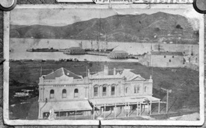 Buildings on Lambton Quay, Wellington, with Queens Wharf behind - Photographer unidentified
