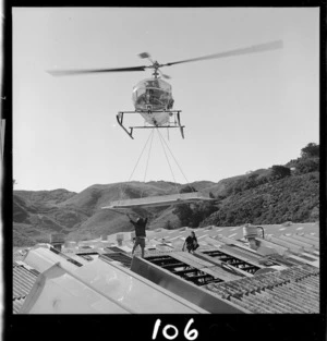 Helicopter transporting construction materials to Dunlop factory, Upper Hutt