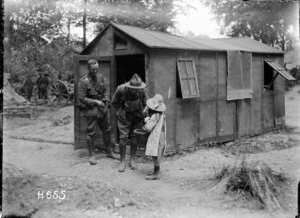 New Zealand soldiers buying sweets from a French girl, World War I