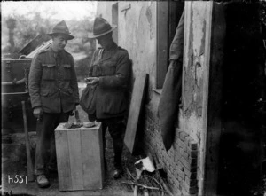 New Zealanders examine shrapnel from a German shell hitting an army building, France