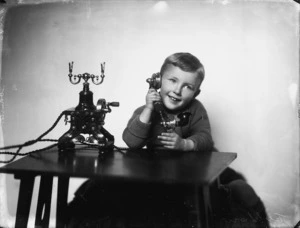 Boy using a telephone