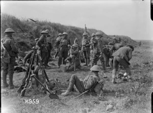 A New Zealand Rifle Brigade platoon shelters during an advance in France, World War I