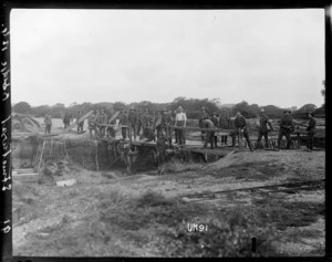 New Zealand Engineers construct a wooden bridge in England, World War I