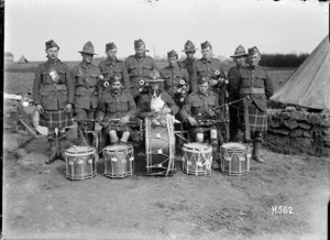 An Auckland Regimental pipe band with canine mascot, France