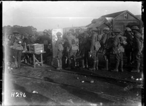 New Zealand troops leaving the line receive tea, cigarettes and biscuits distributed by the YMCA