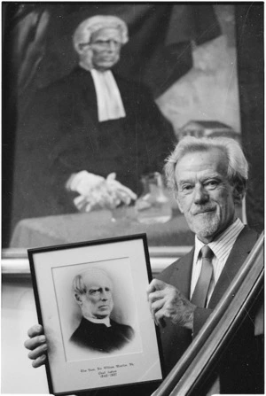 Bill Sutton with portraits of chief justices