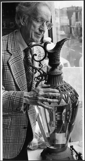 Pharmacist Ronald Castle with a carboy once used for distilling medicine - Photograph taken by Jack Short