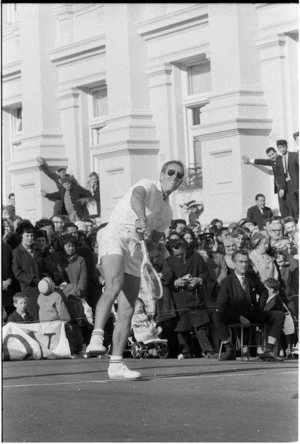 Charlton Heston playing tennis, Mercer Street, Wellington