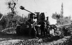 Members of the New Zealand 18th Regiment with a captured self propelled gun