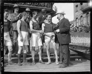 Prime Minister William Massey congratulates New Zealand rowers, London