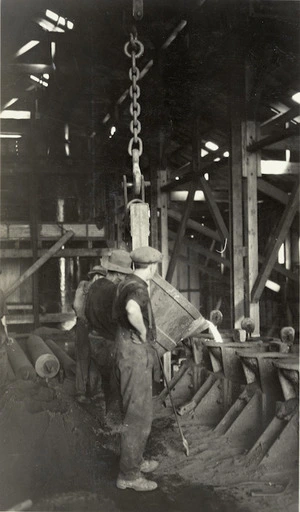 Pouring pipes at Onekaka Iron and Steel Company, Golden Bay