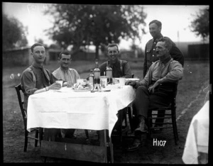 New Zealand army officers have an alfresco dinner during the heat wave