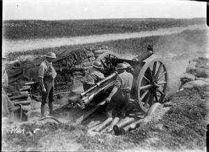A New Zealand 18 pounder gun in action at Beaussart, France, during World War I