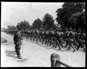 New Zealand troops on route march inspected by General Godley