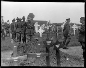 Officers saluting the grave of Brigadier General Johnston killed in 1917