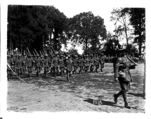 Marching New Zealand troops inspected by Brigadier General Hart