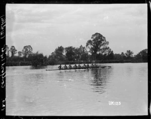 A coxed rowing eight on the Thames at Walton-on-Thames, England